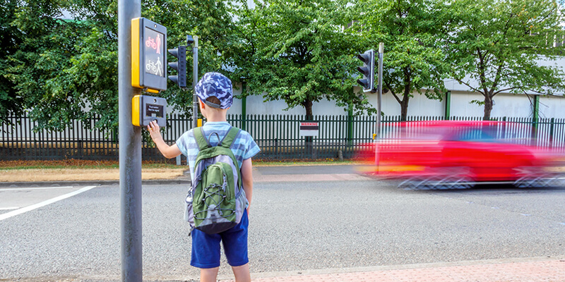 boy at road crossing