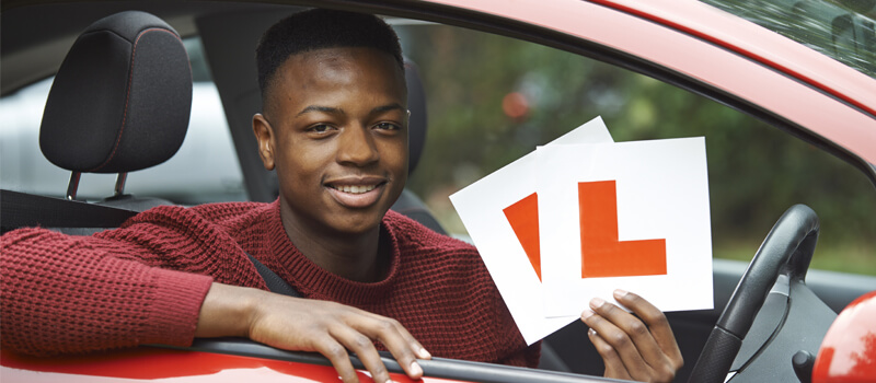 boy-holding-l-plates