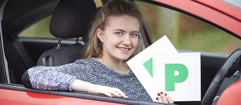 girl holding p plates